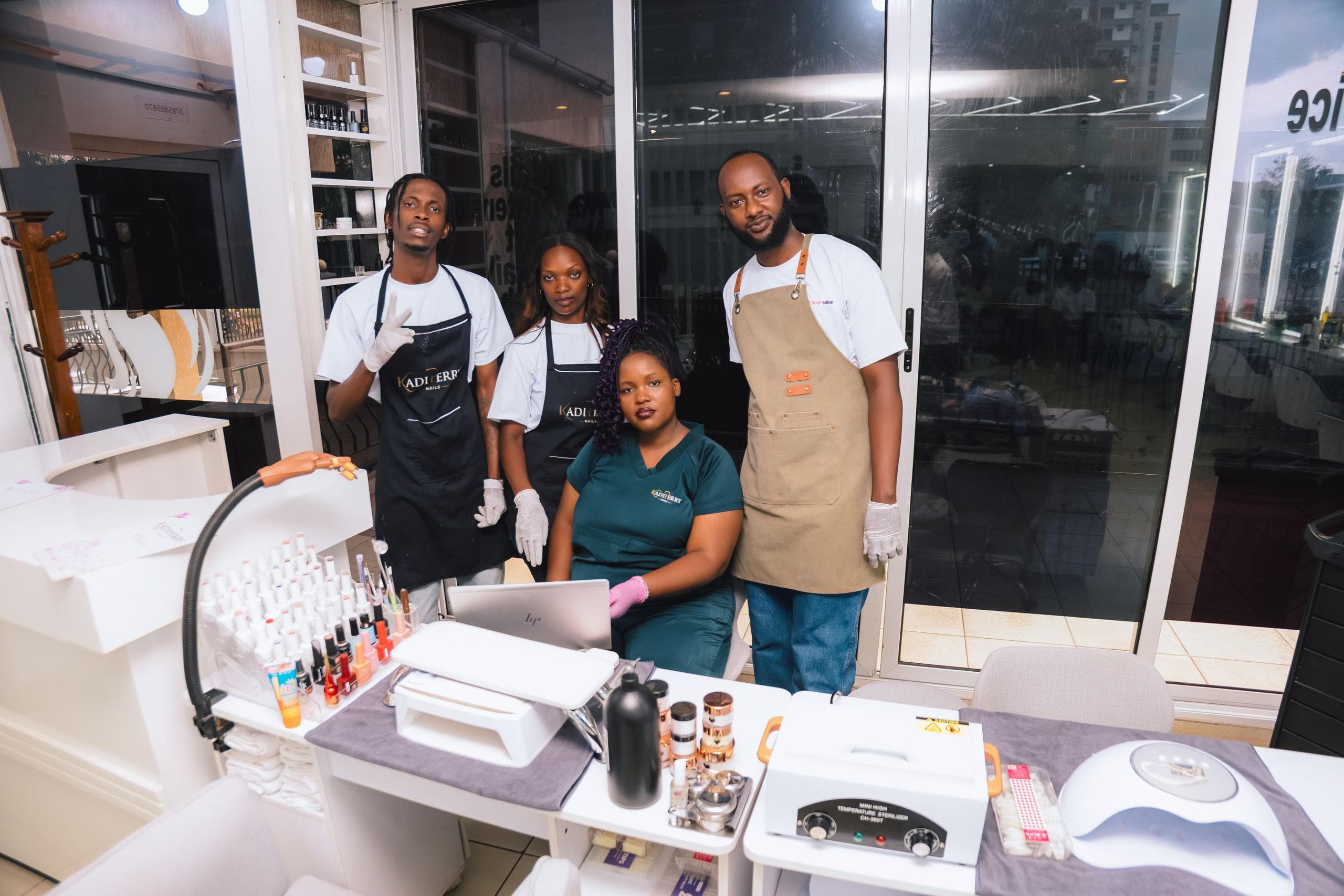 The Kadi Perry Nails team together in the Kigali studio